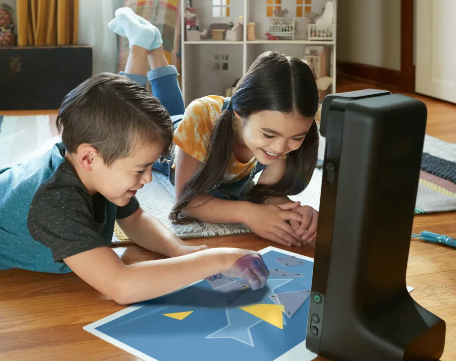 Kids using the Grandma using Amazon Glow gadget